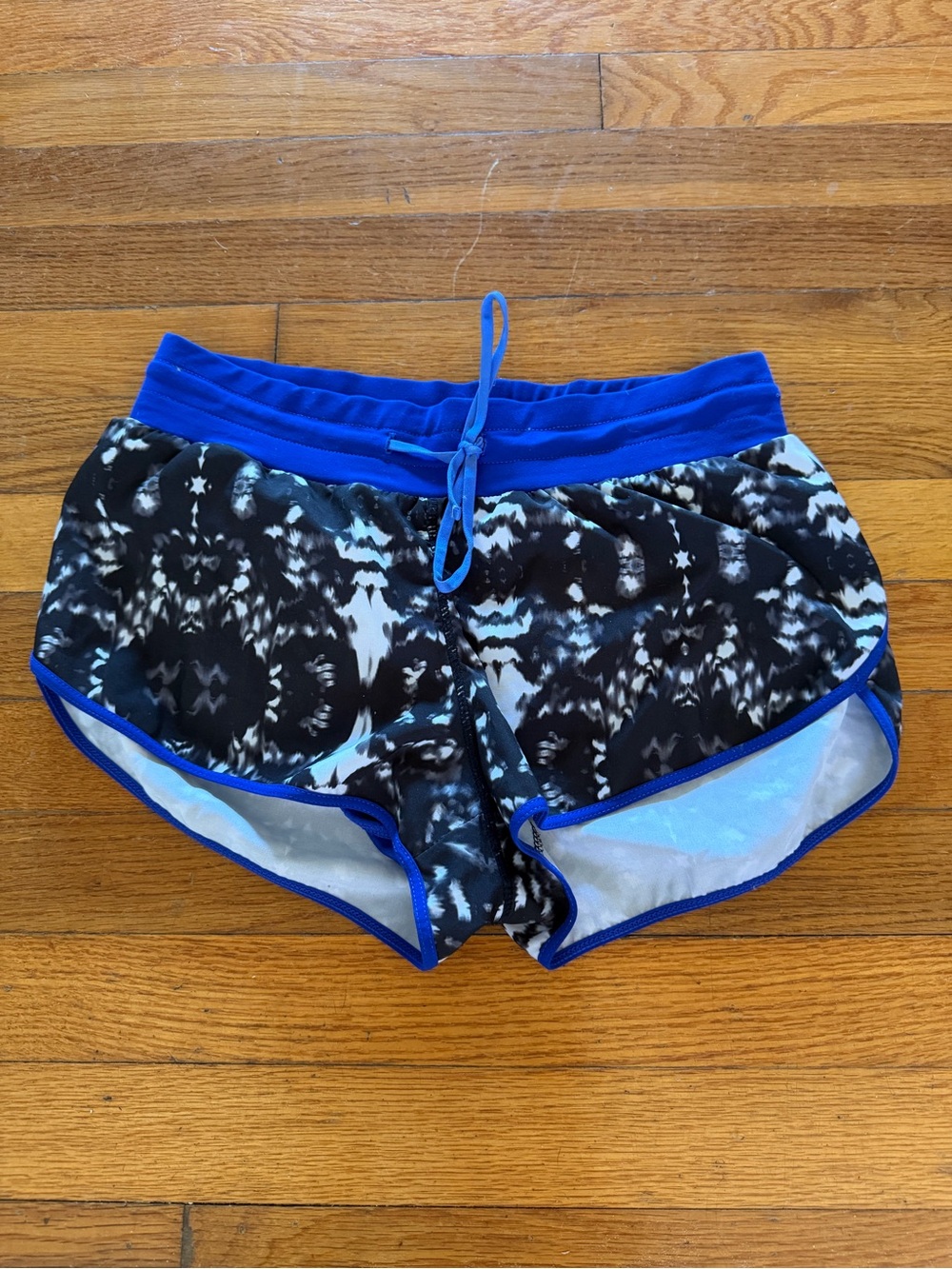 Fabletics Black Patterned Athletic Shorts with Blue Trim